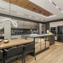 Cozinha planejada integrada com ilha central e iluminação embutida