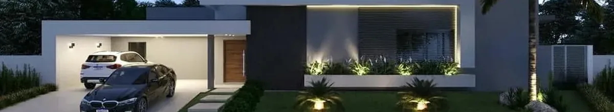 Fachada de residência reformada com iluminação noturna